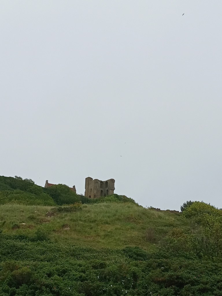 View of Scarborough Castle on top of hill. 